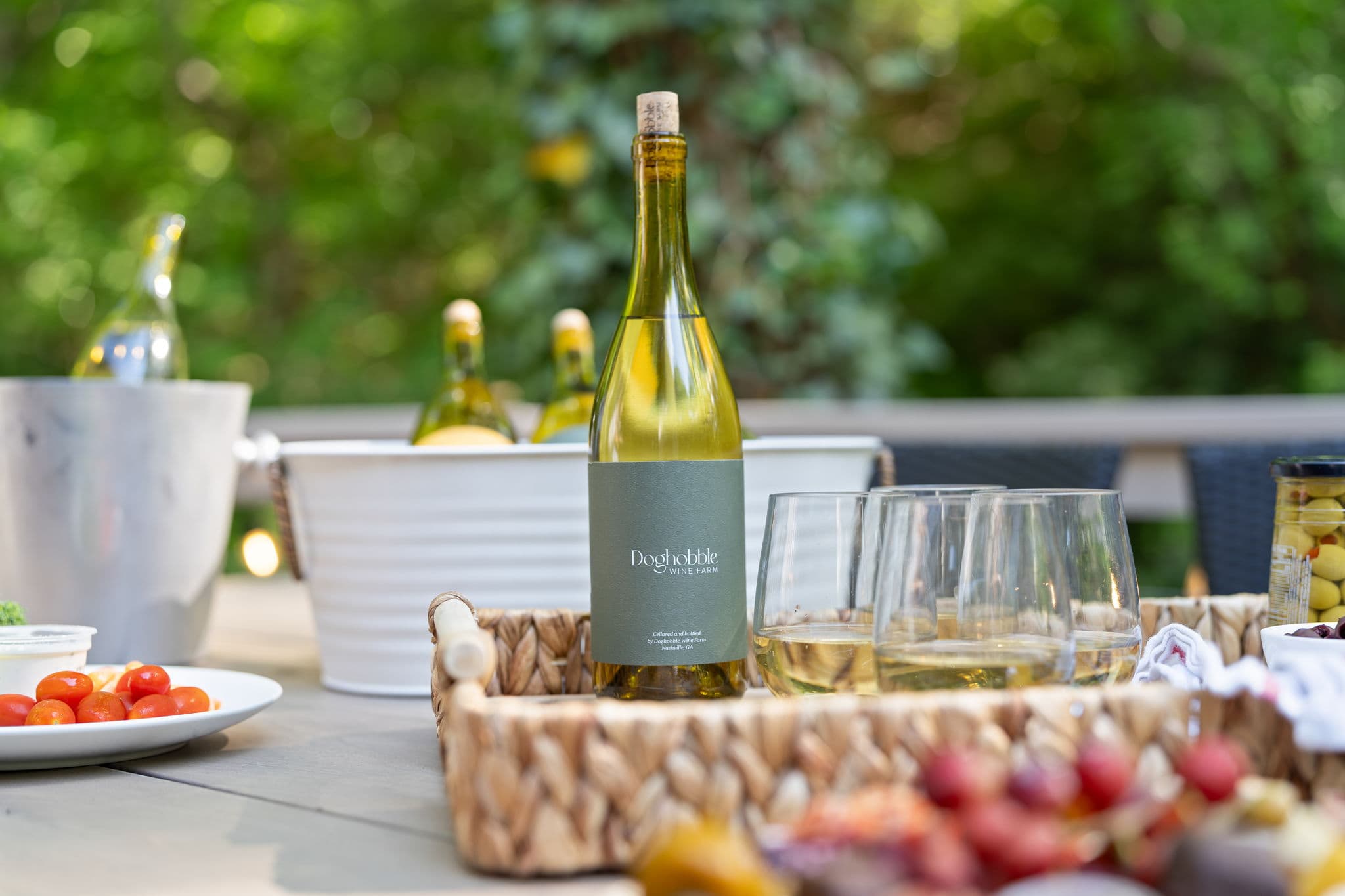 Doghobble Wine Farm bottle with glasses and charcuterie — North Georgia wine country near Dahlonega